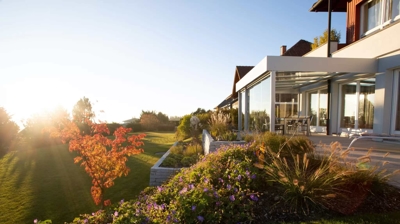 modern backyard landscape of a large house