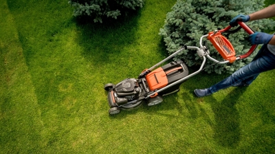 professional is mowing the grass