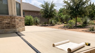 Concrete patio by Heroes Lawn Care of Cedar Park