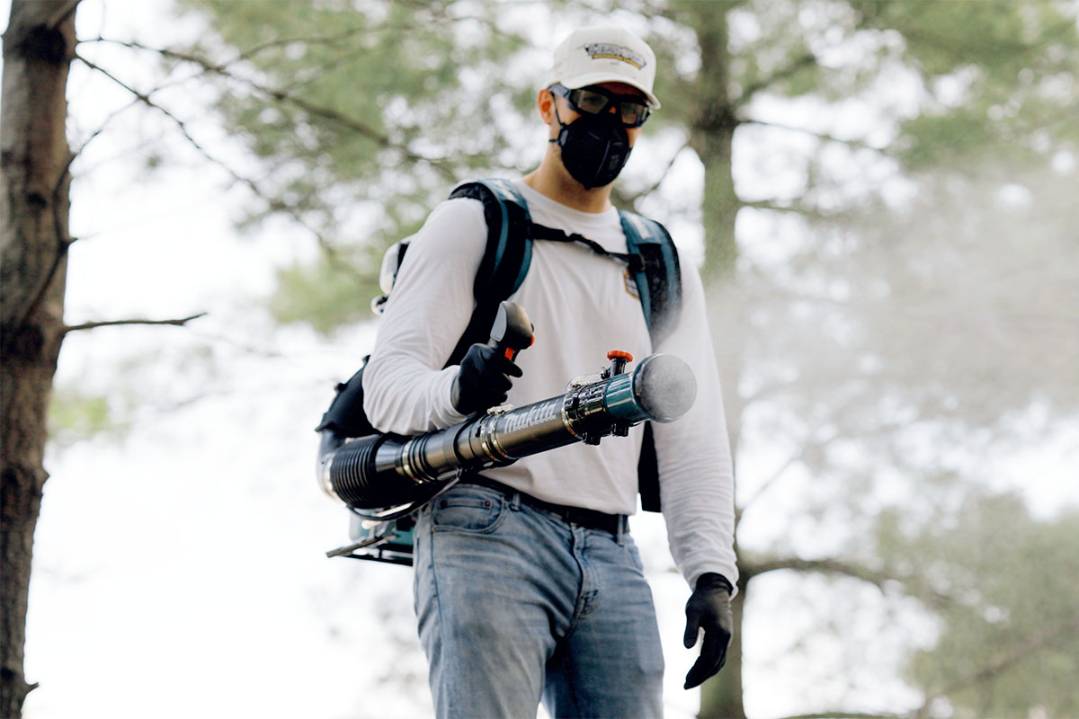 Mosquito Legion Staff Spraying for Bugs