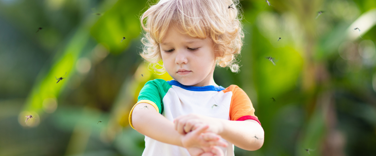 Child outdoors in Manvel surrounded by mosquitoes after summer rain, representing surge in mosquito activity and the need for mosquito control and yard pest management.